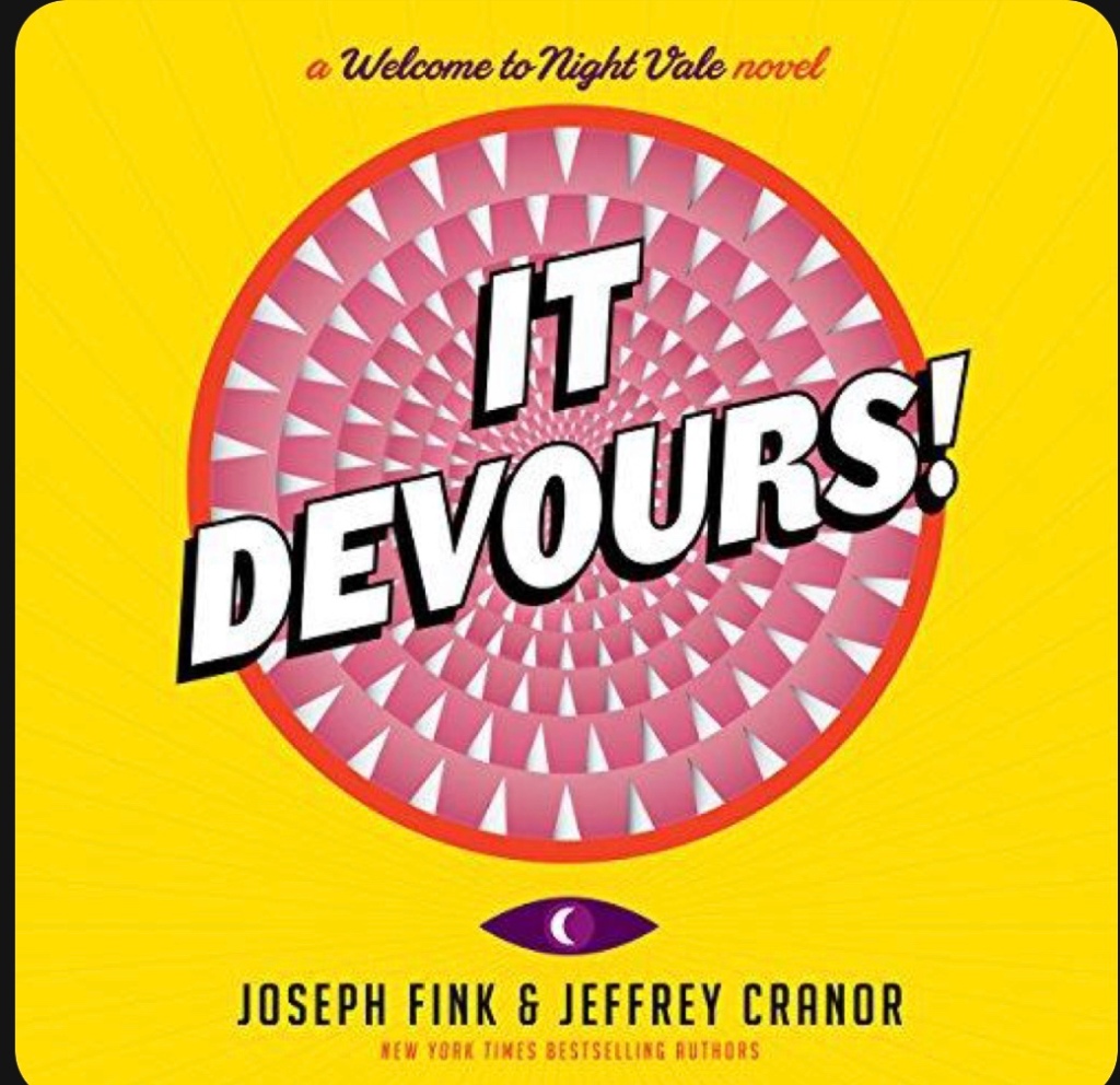 Pink circle with rows of pointy teeth on a yellow background under the text “it Devours!” above the circle it says, “a welcome to nightvale novel”. Below the circle it says Jeffrey Fink and Joseph Candor. A new york times best seller. 
